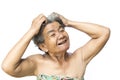 Old woman felt a lot of anxiety about hair loss and itching dandruff issue Royalty Free Stock Photo