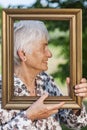 Old woman in frame profile Royalty Free Stock Photo