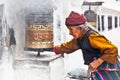 Old woman go around praying wheels in the Bouddanath Stupa, Kat Royalty Free Stock Photo