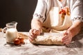 Old woman, grandmother hands weave bread dough. Israeli authentic food. mixing powder to make delicious bread. Raw challah bread Royalty Free Stock Photo