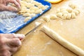 Old woman hands preparing fresh italian pasta gnocchi. Concept Italian Traditional cuisine Royalty Free Stock Photo