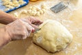 Old woman hands preparing fresh italian pasta gnocchi. Concept Italian Traditional cuisine Royalty Free Stock Photo