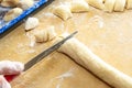 Old woman hands preparing fresh italian pasta gnocchi. Concept Italian Traditional cuisine Royalty Free Stock Photo