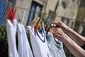 Old woman hanging clothes on rope Royalty Free Stock Photo