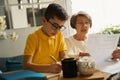 Old woman helping child to study during quarantine Royalty Free Stock Photo