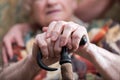 Old woman with her hands on a cane Royalty Free Stock Photo