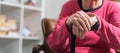 Old woman with her hands on a cane Royalty Free Stock Photo