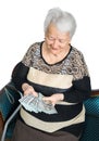 Old woman holding money in hands Royalty Free Stock Photo