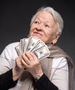 Old woman holding money in hands Royalty Free Stock Photo