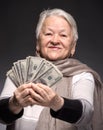 Old woman holding money in hands Royalty Free Stock Photo