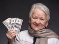 Old woman holding money in hands Royalty Free Stock Photo