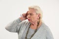 Old woman holding pills isolated. Royalty Free Stock Photo