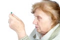 The old woman holds in hands capsule Royalty Free Stock Photo