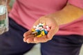 An old woman holds pills in her hands. Selective focus. Royalty Free Stock Photo