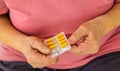 An old woman holds pills in her hands. Selective focus. Royalty Free Stock Photo