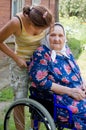 Old woman in an invalid armchair Royalty Free Stock Photo