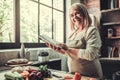 Old woman in kitchen Royalty Free Stock Photo