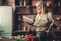 Old woman in kitchen Royalty Free Stock Photo
