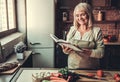 Old woman in kitchen Royalty Free Stock Photo