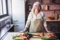 Old woman in the kitchen Royalty Free Stock Photo