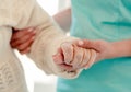 Old woman leaning on nurse while walking Royalty Free Stock Photo