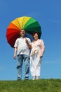 Old woman and man holding umbrella Royalty Free Stock Photo