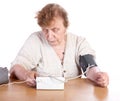 The old woman measures arterial pressure upon Royalty Free Stock Photo