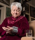 Old woman measures arterial pressure Royalty Free Stock Photo