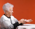 Old woman measures arterial pressure Royalty Free Stock Photo