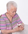 Old woman measures arterial pressure Royalty Free Stock Photo