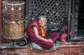 Old woman near Bodnath stupa Royalty Free Stock Photo