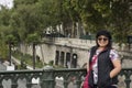 Old woman posing for take photo on bridge crossover Seine river Royalty Free Stock Photo