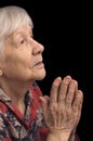 Old woman prays Royalty Free Stock Photo