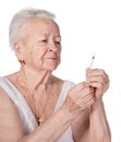 Old woman preparing syringe for making insulin injection Royalty Free Stock Photo