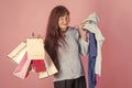 Old woman on purchases. Old lady with present package on pink background. Royalty Free Stock Photo