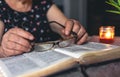 An old woman reads the Bible, hands close up. Royalty Free Stock Photo