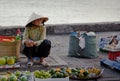 Old woman selling fruit in a market