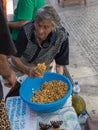 Old Woman Sells Fresh Yellow Natural Lupin Beans in Coimbra& x27;s St