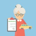 Old woman shows car insurance.