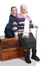 Old woman sitting on a box with her granddaughter Royalty Free Stock Photo