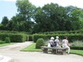 old woman sitting in a park in Vienna Austria