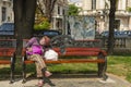 Old woman sleeping outside