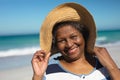 Old woman smiling at the beach Royalty Free Stock Photo