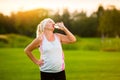 Old woman with sports bottle. Royalty Free Stock Photo