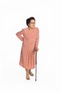 Old woman suffering from low back pain on a white background , standing with walking stick Royalty Free Stock Photo