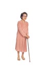 Old woman suffering from low back pain on a white background , standing with walking stick Royalty Free Stock Photo