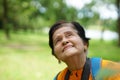 The old woman taking photo on camera. Grandmother wants to capture the moment. Royalty Free Stock Photo