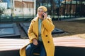 Old woman talking of the her phone. Senior blonde woman has a happy conversation at cellphone. Smiling woman using phone Royalty Free Stock Photo