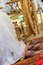 old woman using an old wool spinning wheel Royalty Free Stock Photo