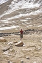 The old woman of the village blesses the men who return to Shimshal after bringing in Upper Shimshal oil reserves and other things